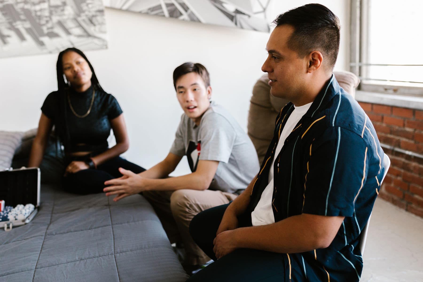 College students talking together in a dorm room